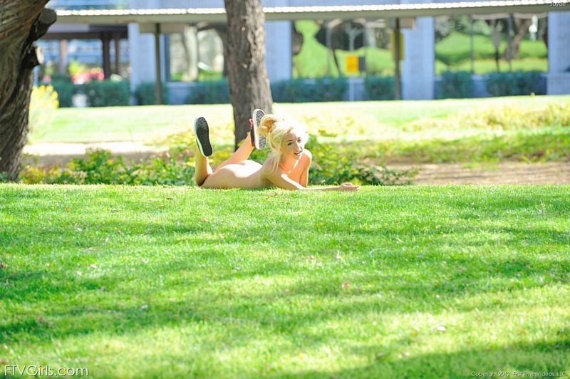 Daring blonde girl does naked cartwheels in the park #67291596