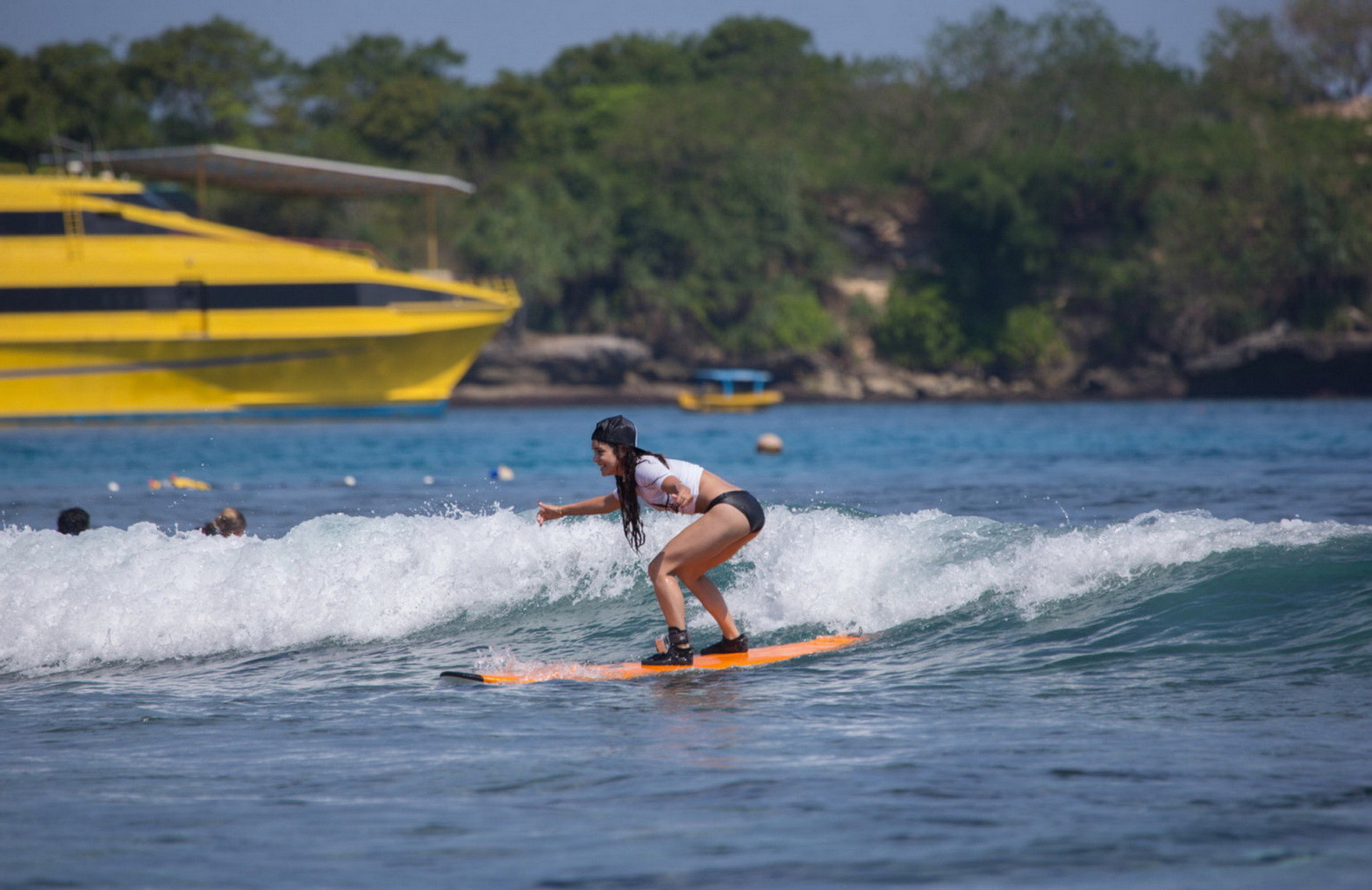 Vanessa hudgens en bikini noir et surfant au oakley learn to surf e.
 #75228562