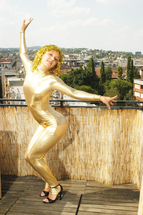 Flexible teen in shiny gold catsuit #70799507
