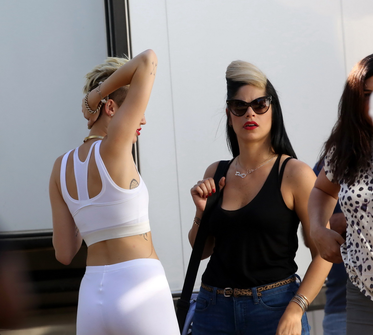 Miley Cyrus wearing the white tights  a sports bra on a music video set in LA #75230631