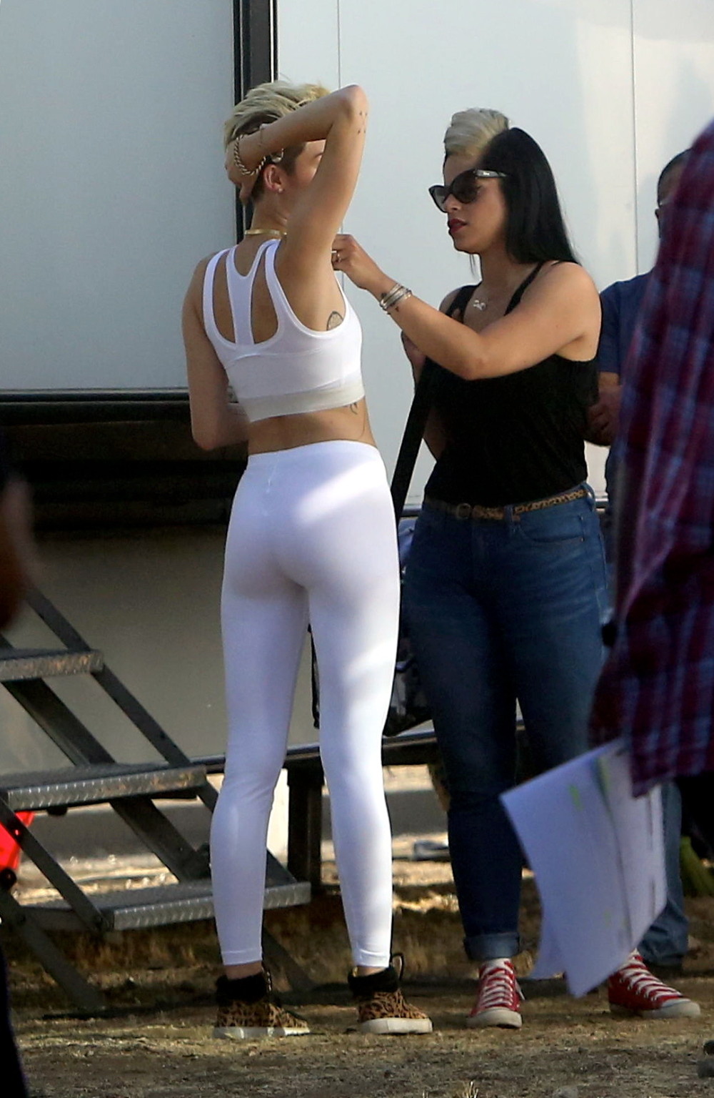 Miley Cyrus wearing the white tights  a sports bra on a music video set in LA #75230644
