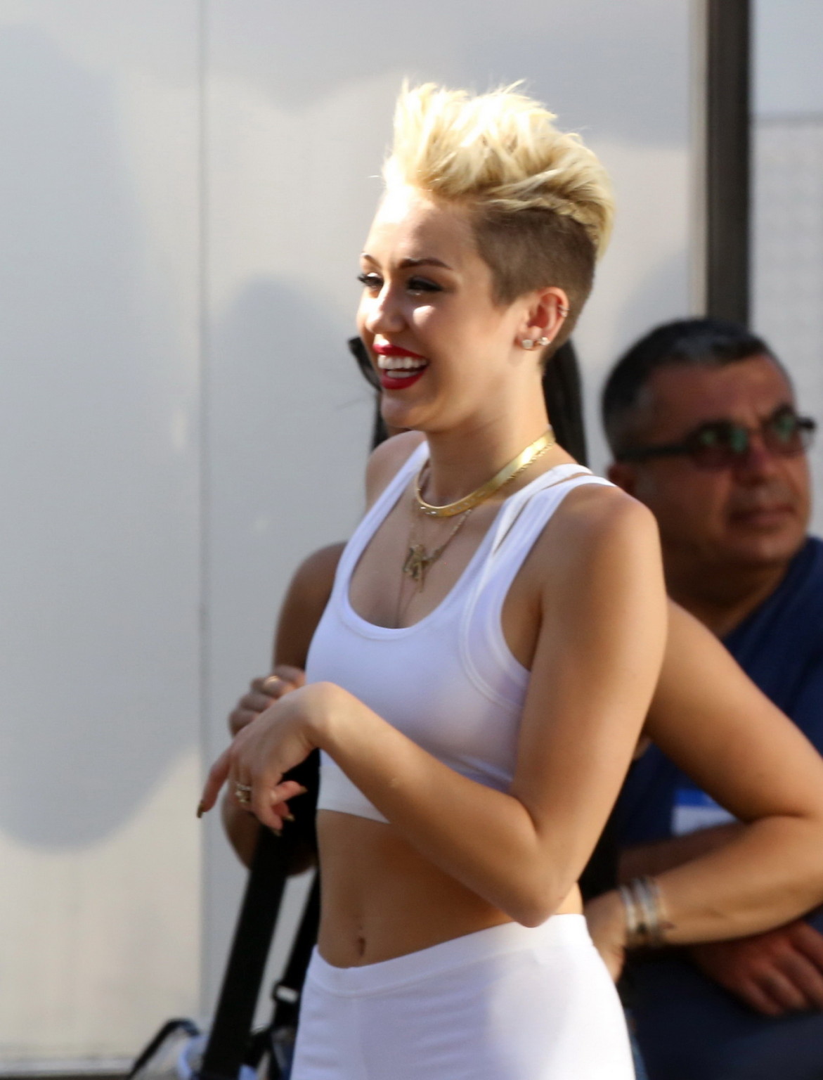 Miley Cyrus wearing the white tights  a sports bra on a music video set in LA #75230698