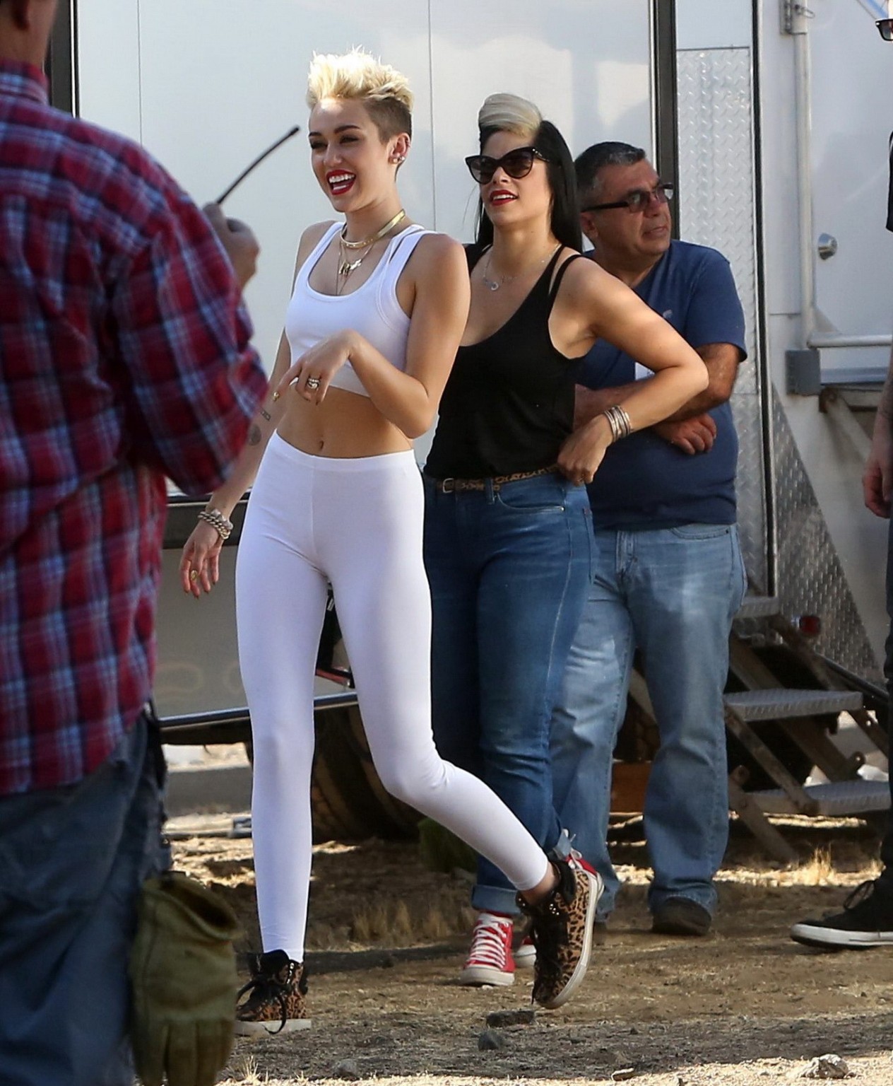 Miley Cyrus wearing the white tights  a sports bra on a music video set in LA #75230721