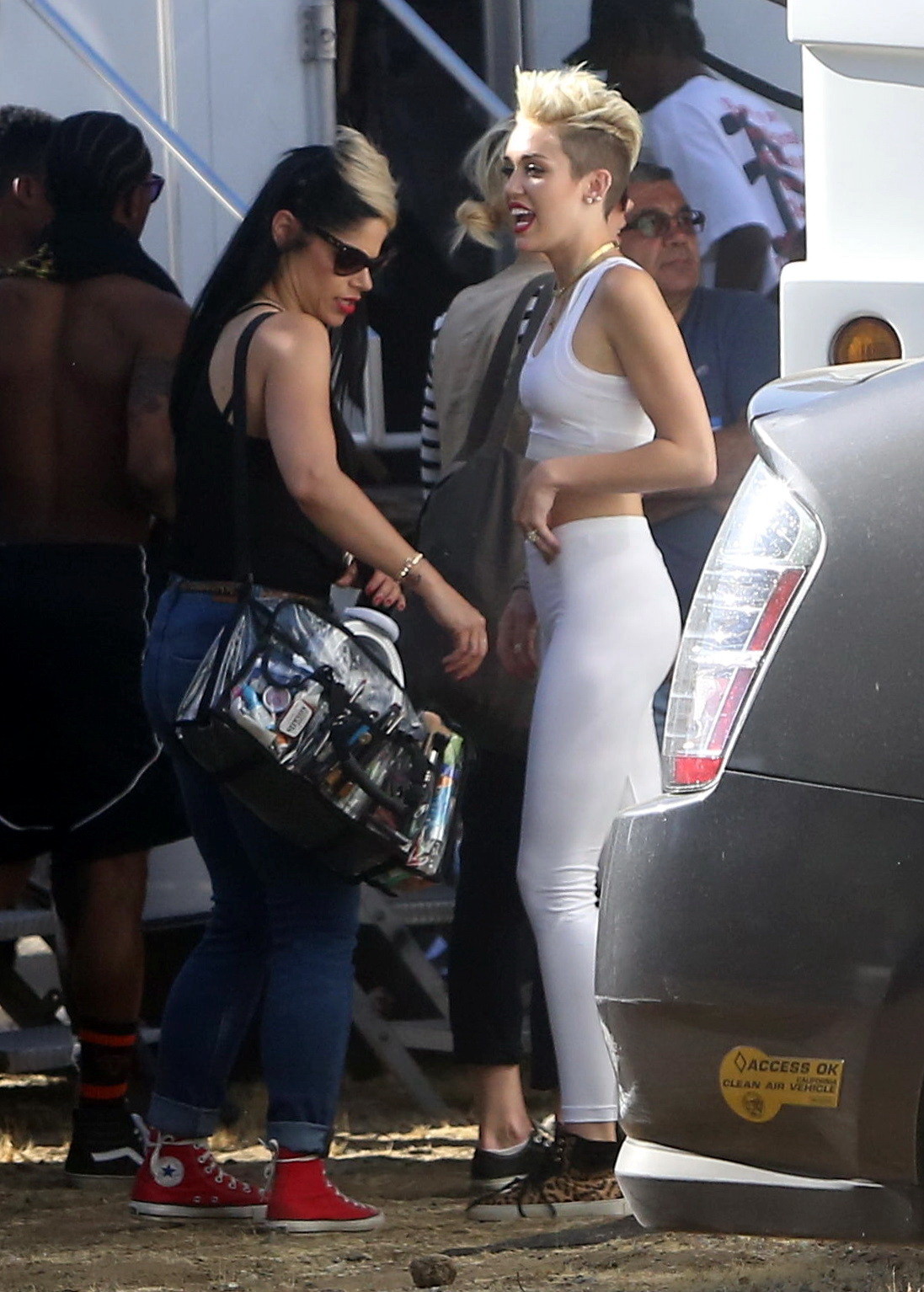 Miley Cyrus wearing the white tights  a sports bra on a music video set in LA #75230734