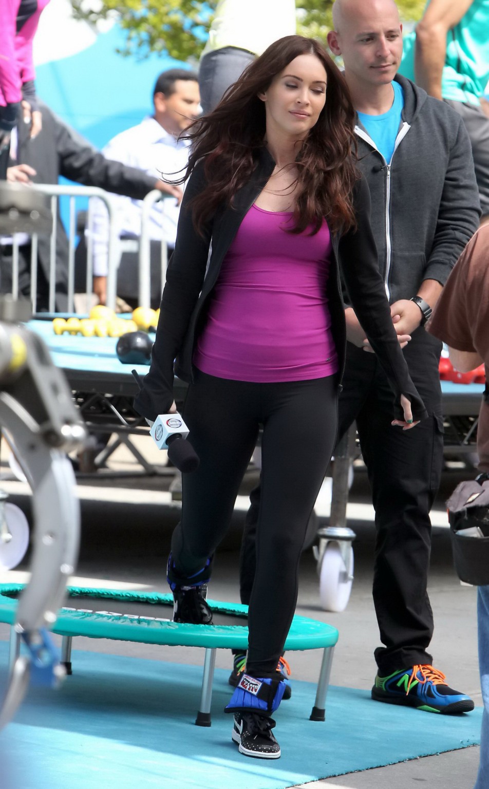 Megan Fox cleavy wearing tight outfit while jumps on trampoline at the TMNT set #75233051
