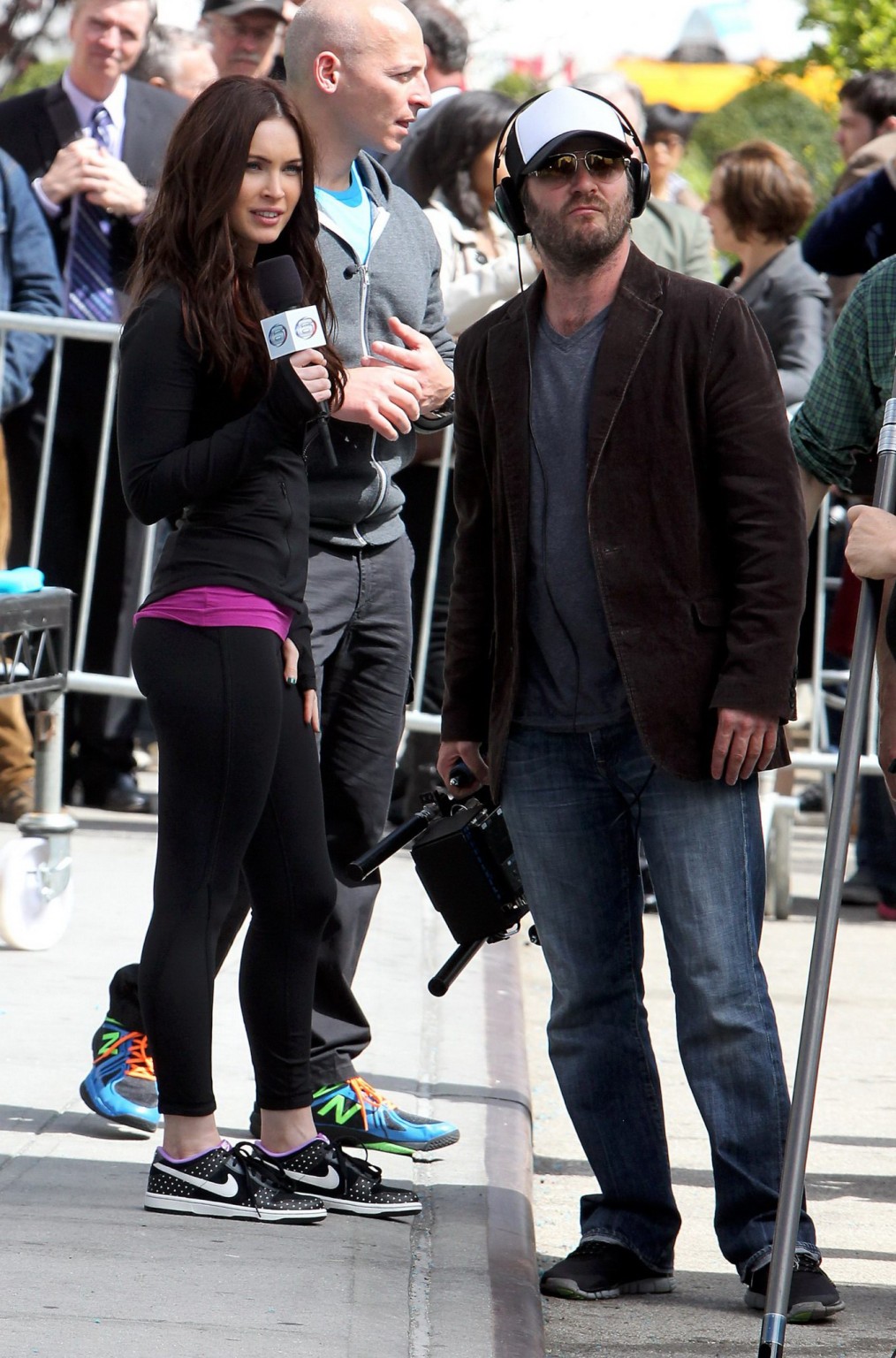 Megan Fox cleavy wearing tight outfit while jumps on trampoline at the TMNT set #75233084