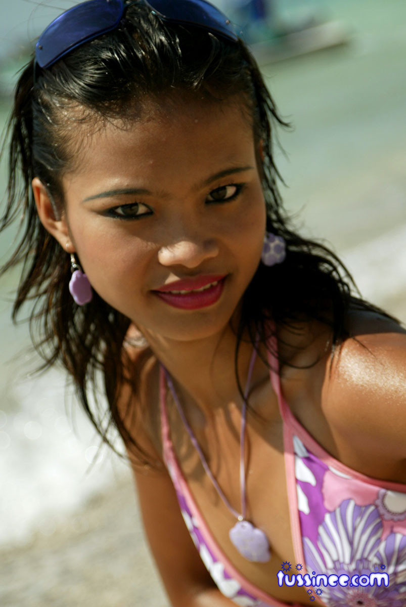 Asian teen model at the beach poses on a Jet Ski #67729902