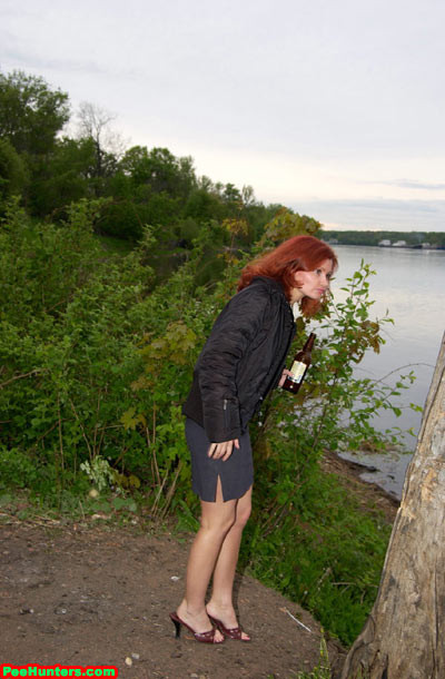 Redhead slut peeing near river after beer drinking #78616700