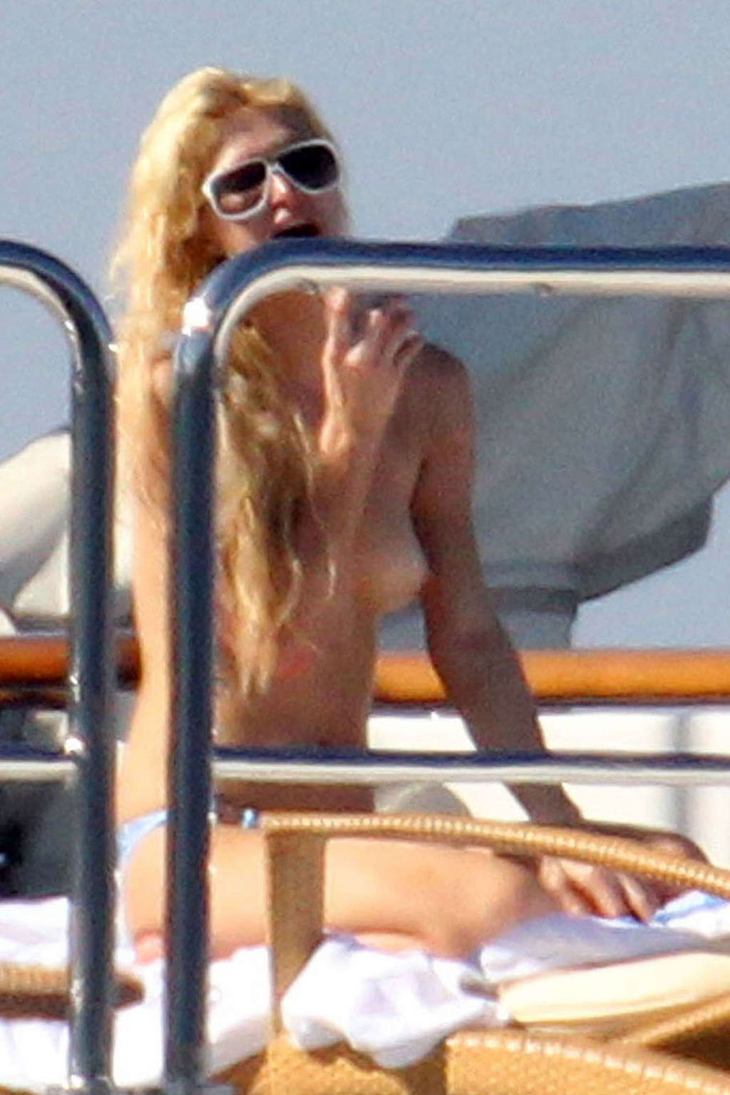 Paris Hilton exposing her nice tits while sunbathing topless on yacht paparazzi  #75340661
