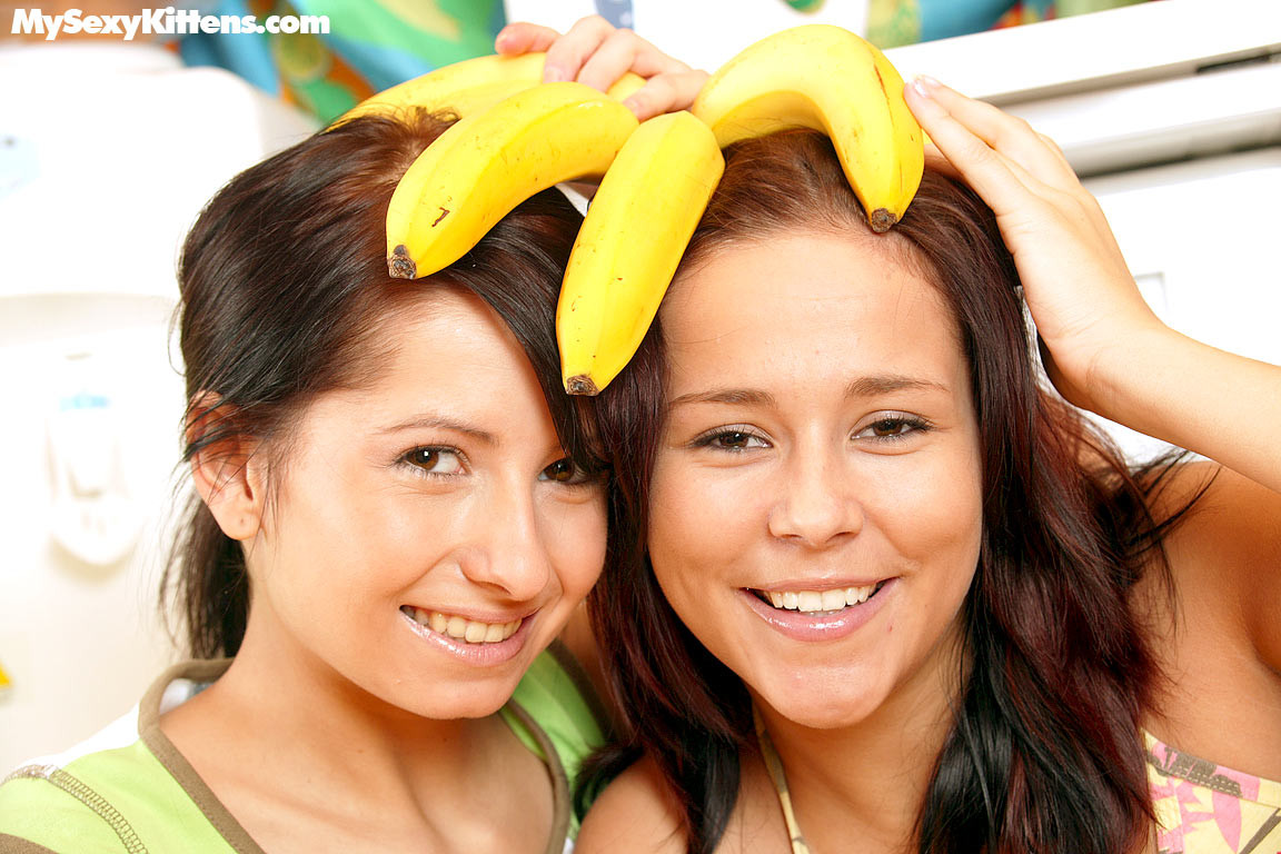 Two naughty young sluts fuck each other with a banana #76352663