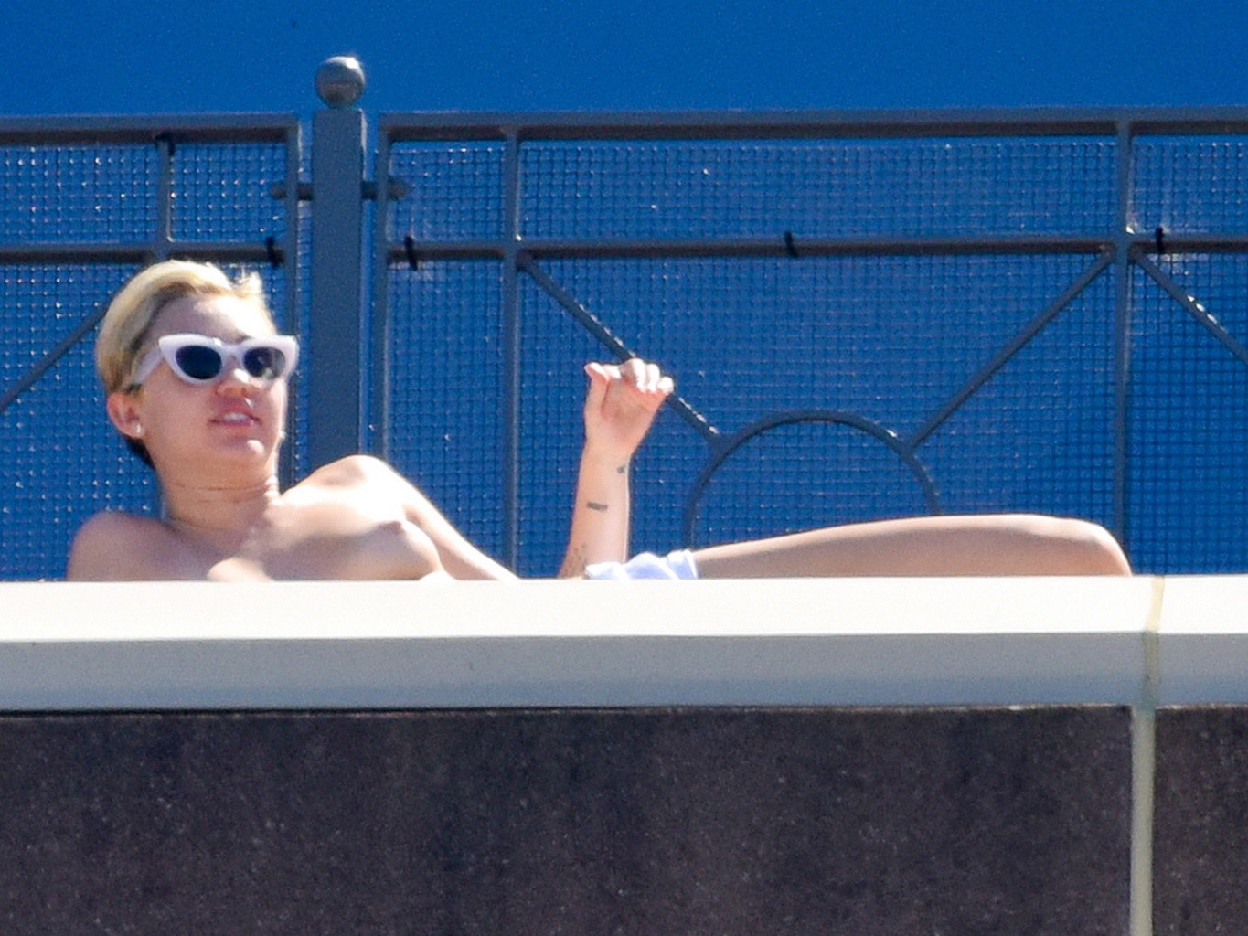 Miley Cyrus tanning topless at the hotel balcony in Sydney #75183712