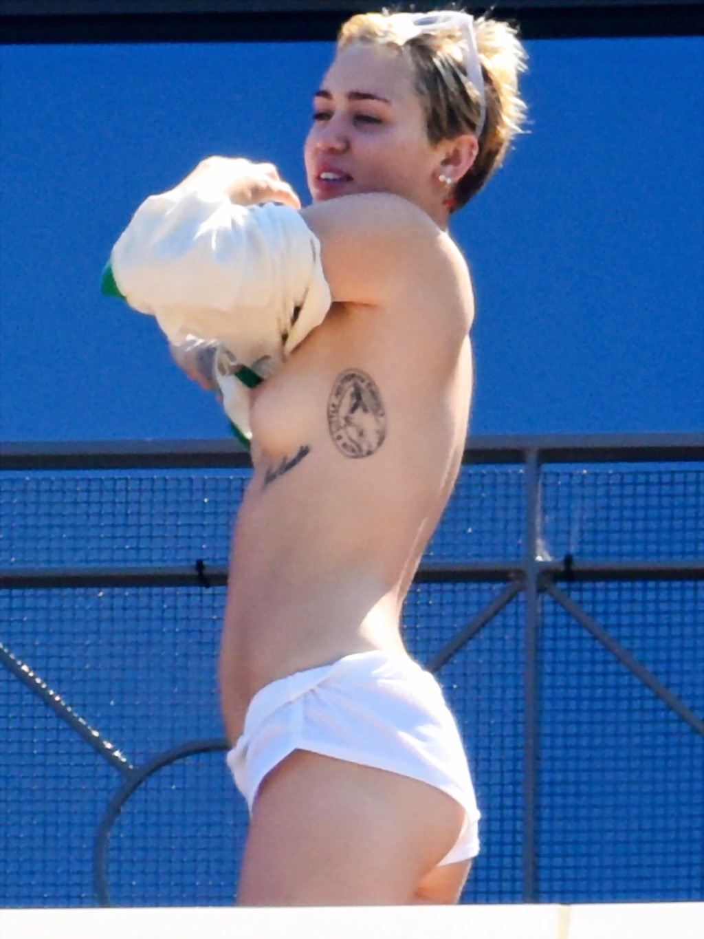 Miley Cyrus tanning topless at the hotel balcony in Sydney #75183729