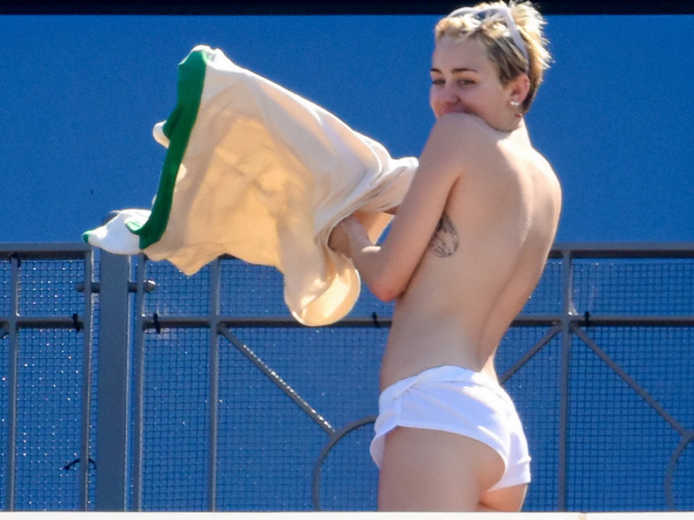 Miley Cyrus tanning topless at the hotel balcony in Sydney #75183737