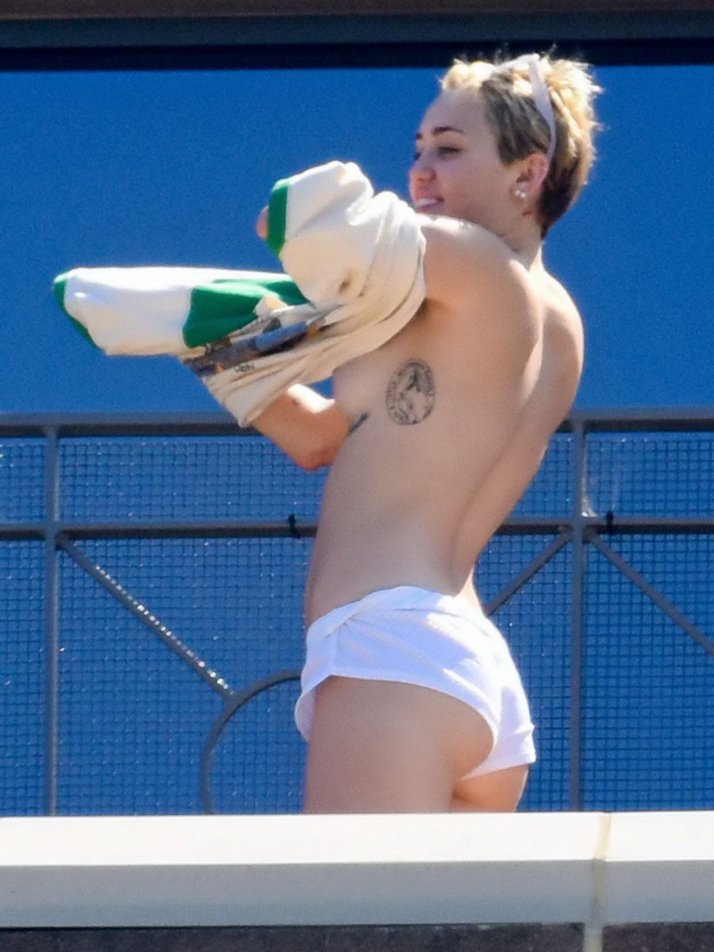 Miley Cyrus tanning topless at the hotel balcony in Sydney #75183740