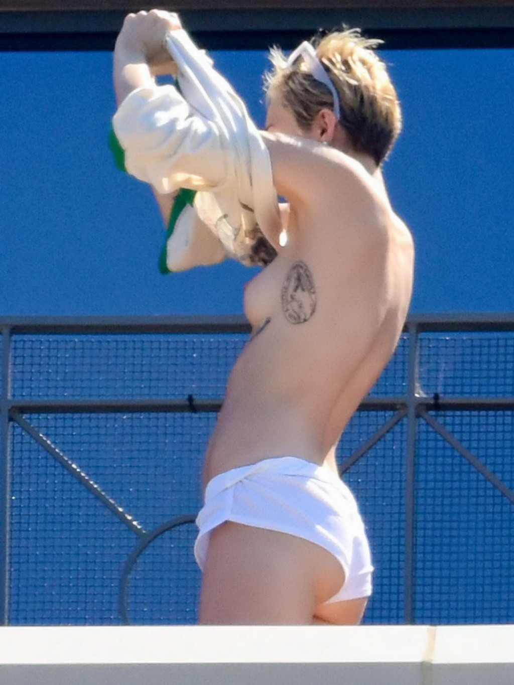 Miley Cyrus tanning topless at the hotel balcony in Sydney #75183763