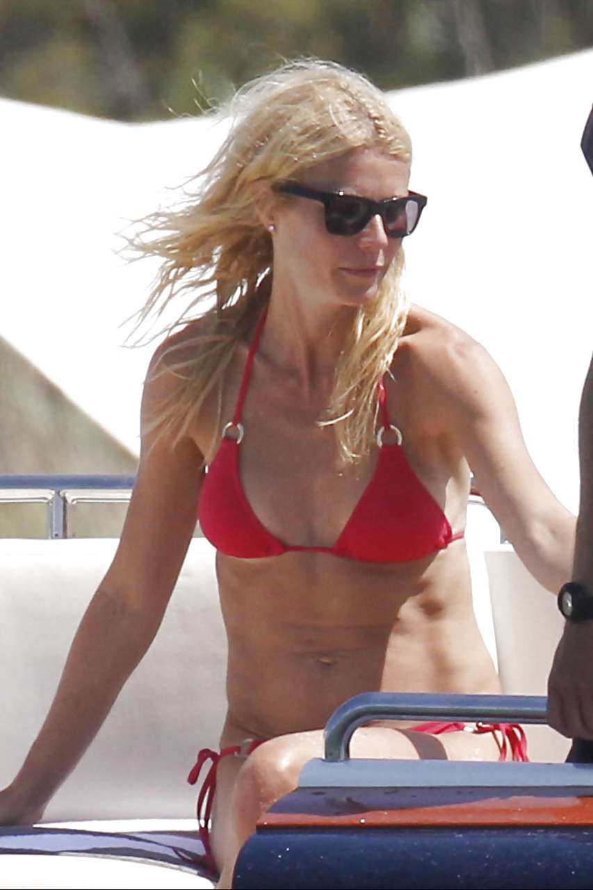 Gwyneth Paltrow showing her panties upskirt and great ass in red bikini on beach #75288784