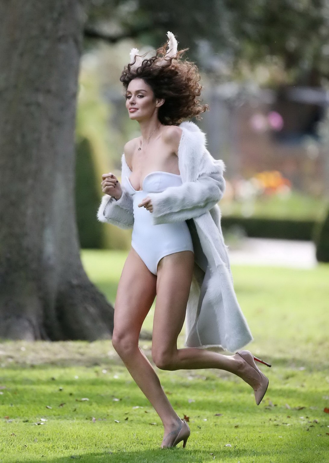 Nicole Trunfio slips out of her white tube bodysuit while shooting at the garden #75224228