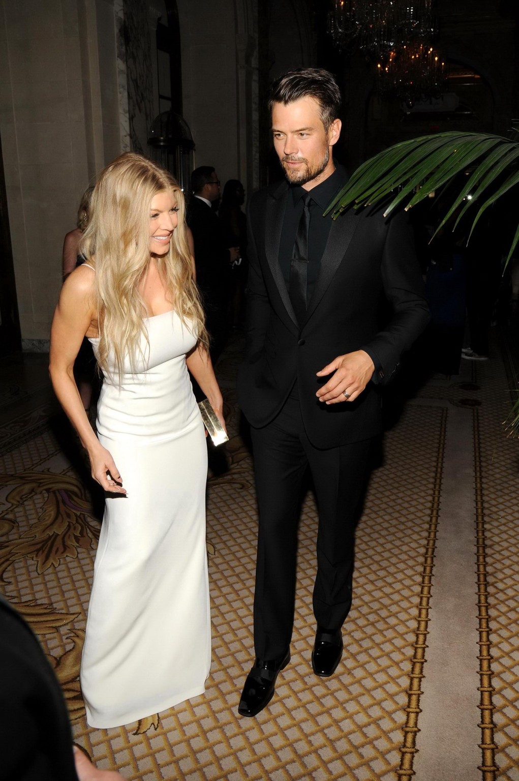 Stacy Ferguson cleavy wearing a white low cut dress at the amfAR Inspiration Gal #75193737