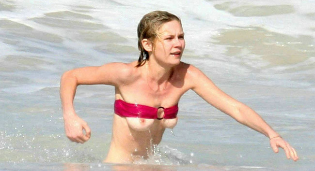 Celebrity Kirsten Dunst nice nipple slip on the beach #75400532