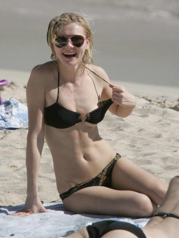 Celebrity Kirsten Dunst nice nipple slip on the beach #75400616