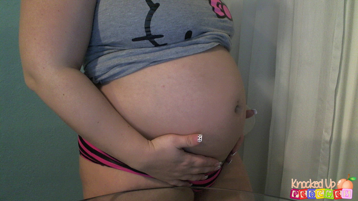 Pregnant pornstar Georgia Peach shows off her big swollen stomach as she strips  #67576350