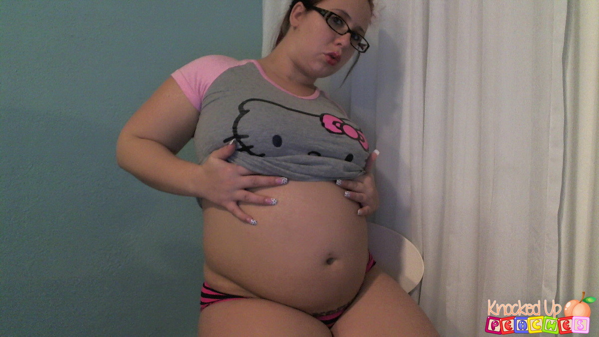 Pregnant pornstar Georgia Peach shows off her big swollen stomach as she strips  #67576362