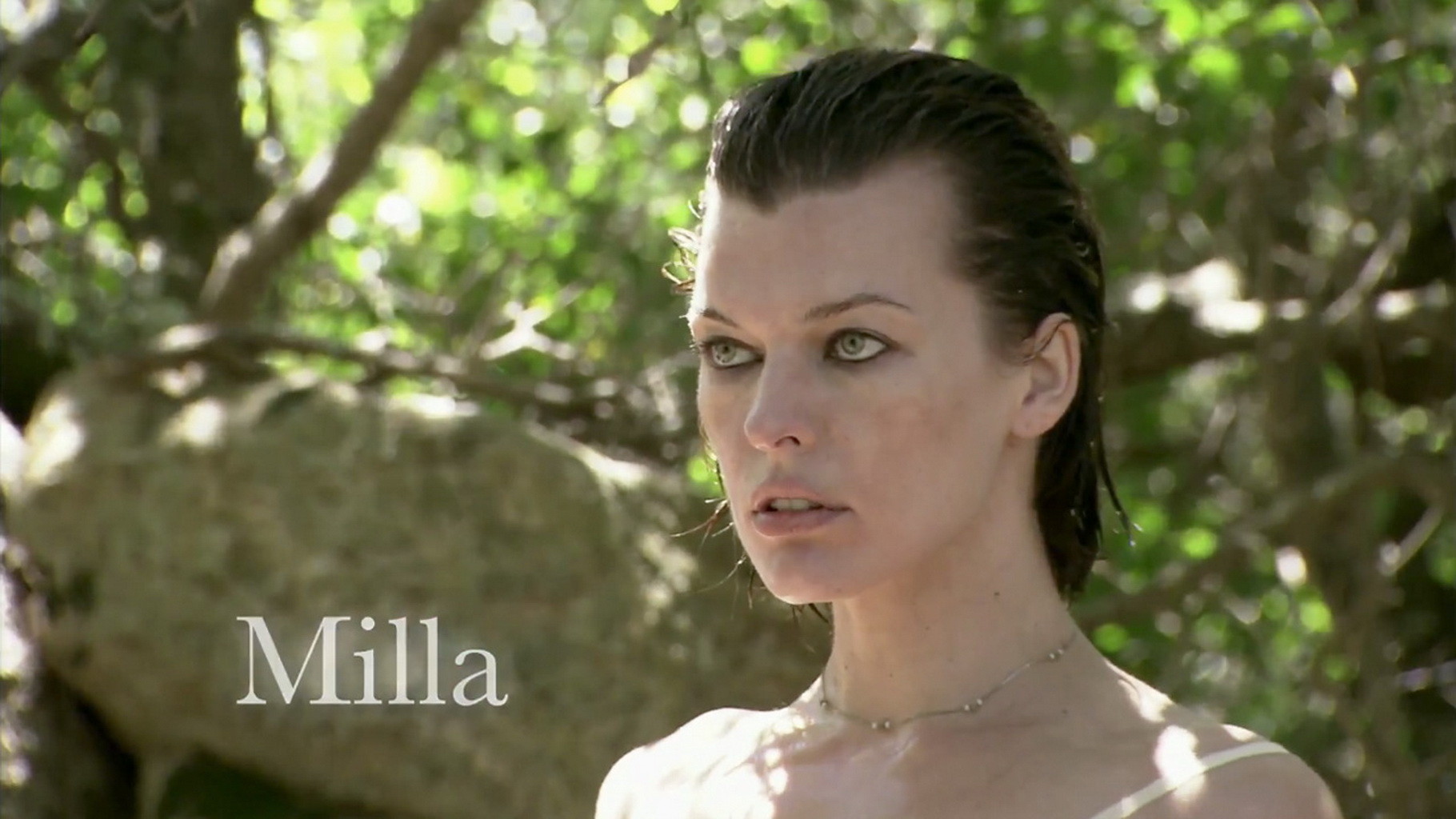 Beautiful Milla Jovovich showing off her boobs in topless and some c-thru underw