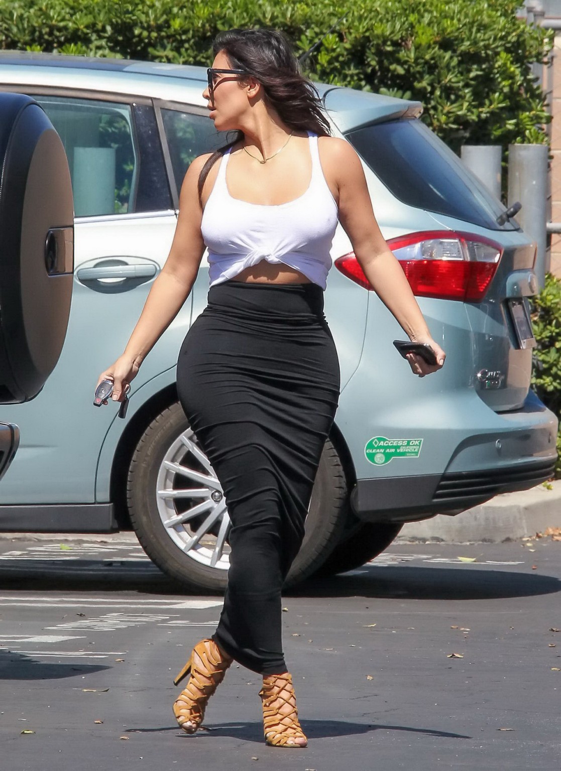 Kim Kardashian busty wearing tank top and tight skirt at the BunimMurray Product #75185462