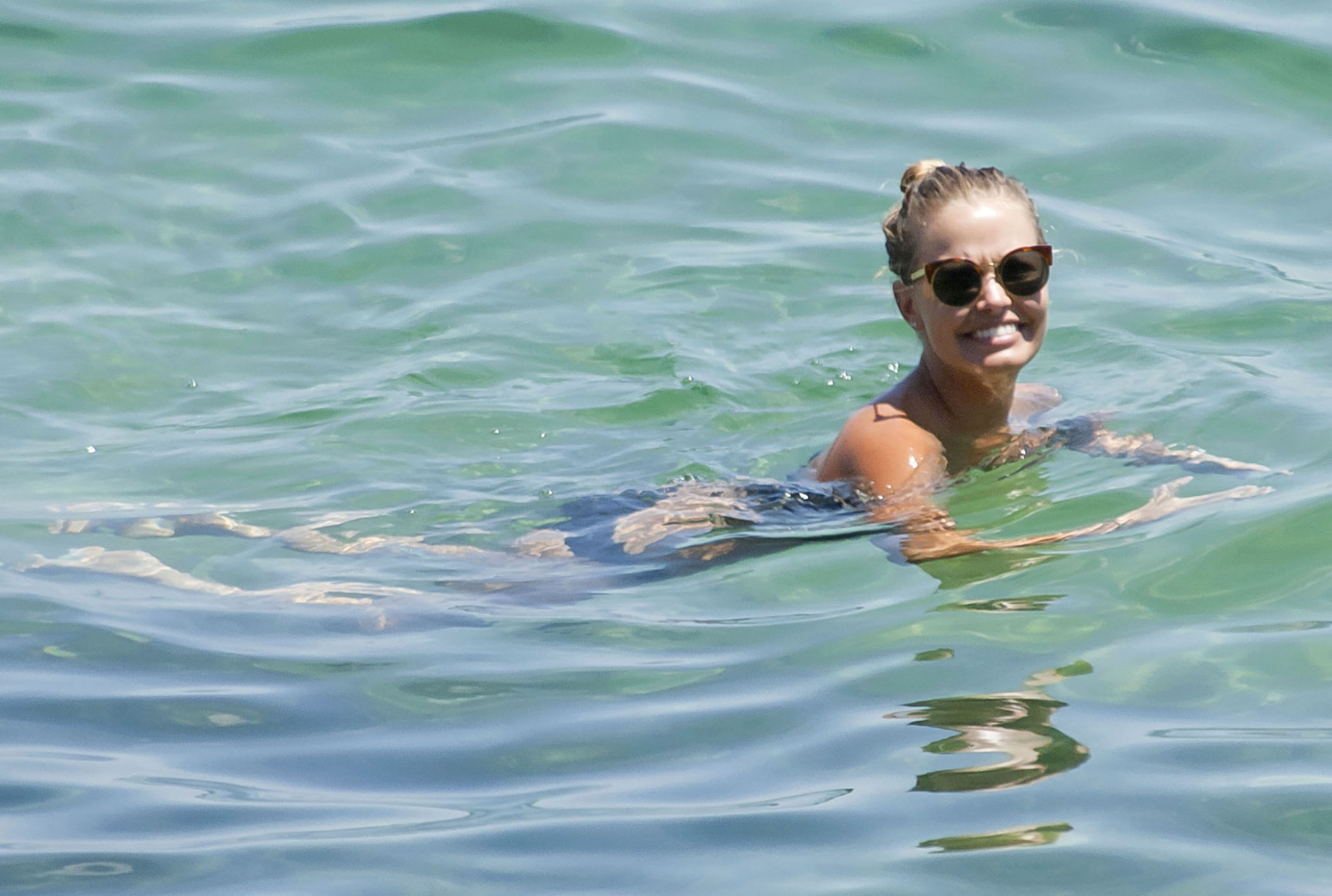 Busty Lara Bingle tanning topless on Bondi Beach in Sydney #75318526