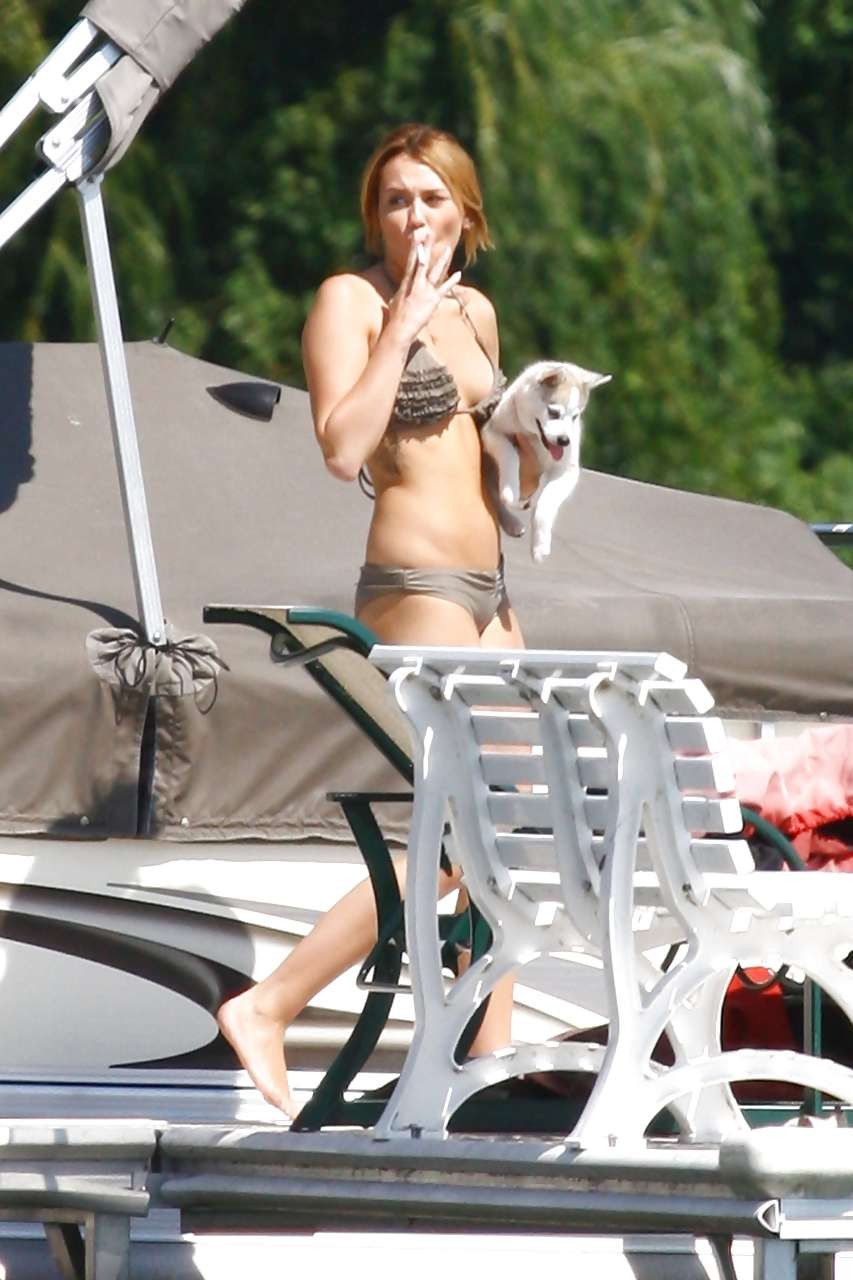 Miley Cyrus posing without bra and looking very sexy in bikini paparazzi picture #75293012