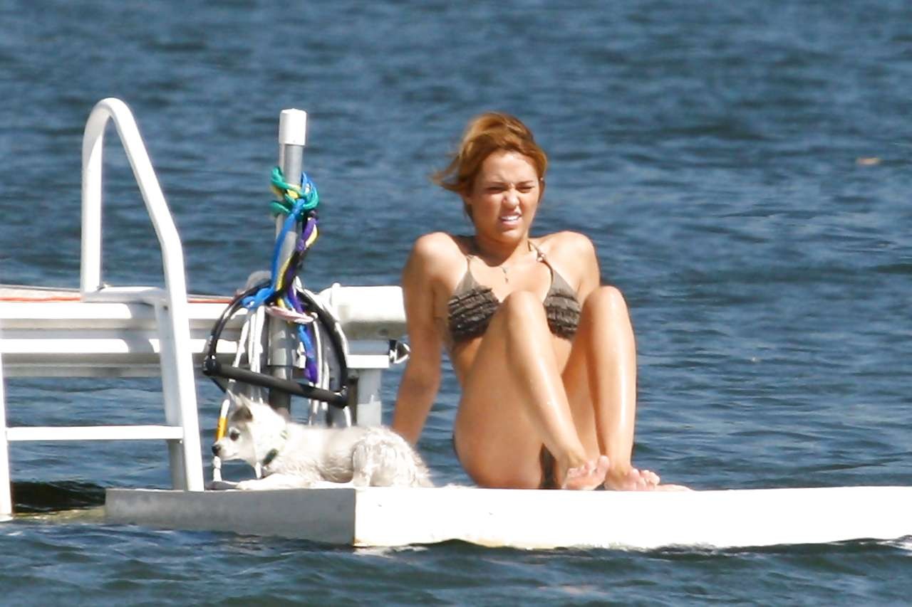 Miley Cyrus posing without bra and looking very sexy in bikini paparazzi picture #75293076
