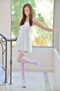 Long Legged Brunette Beauty In White Stockings And Garters