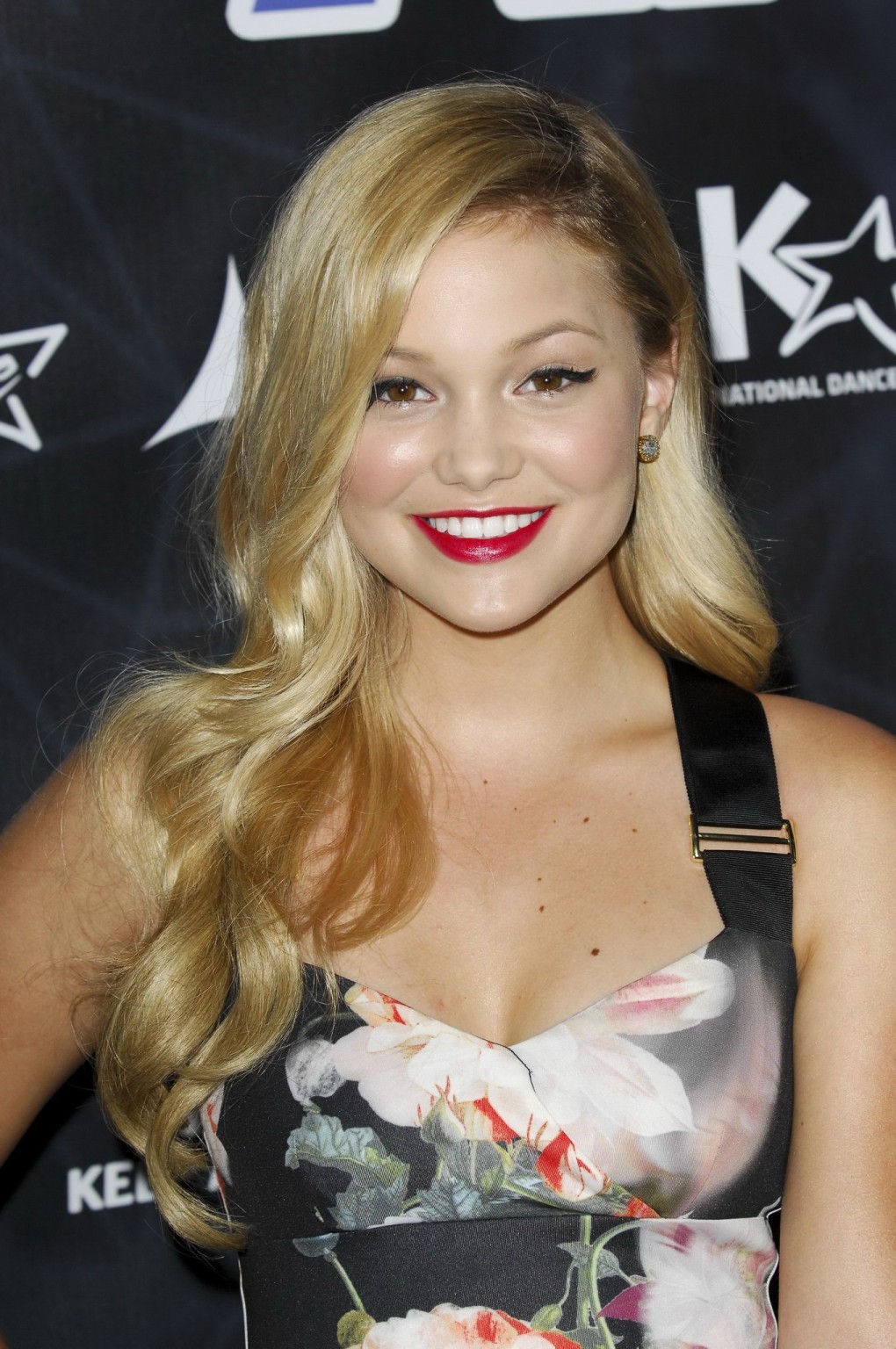 Olivia Holt showing big cleavage in a tight floral dress for the Industry Dance  #75186152