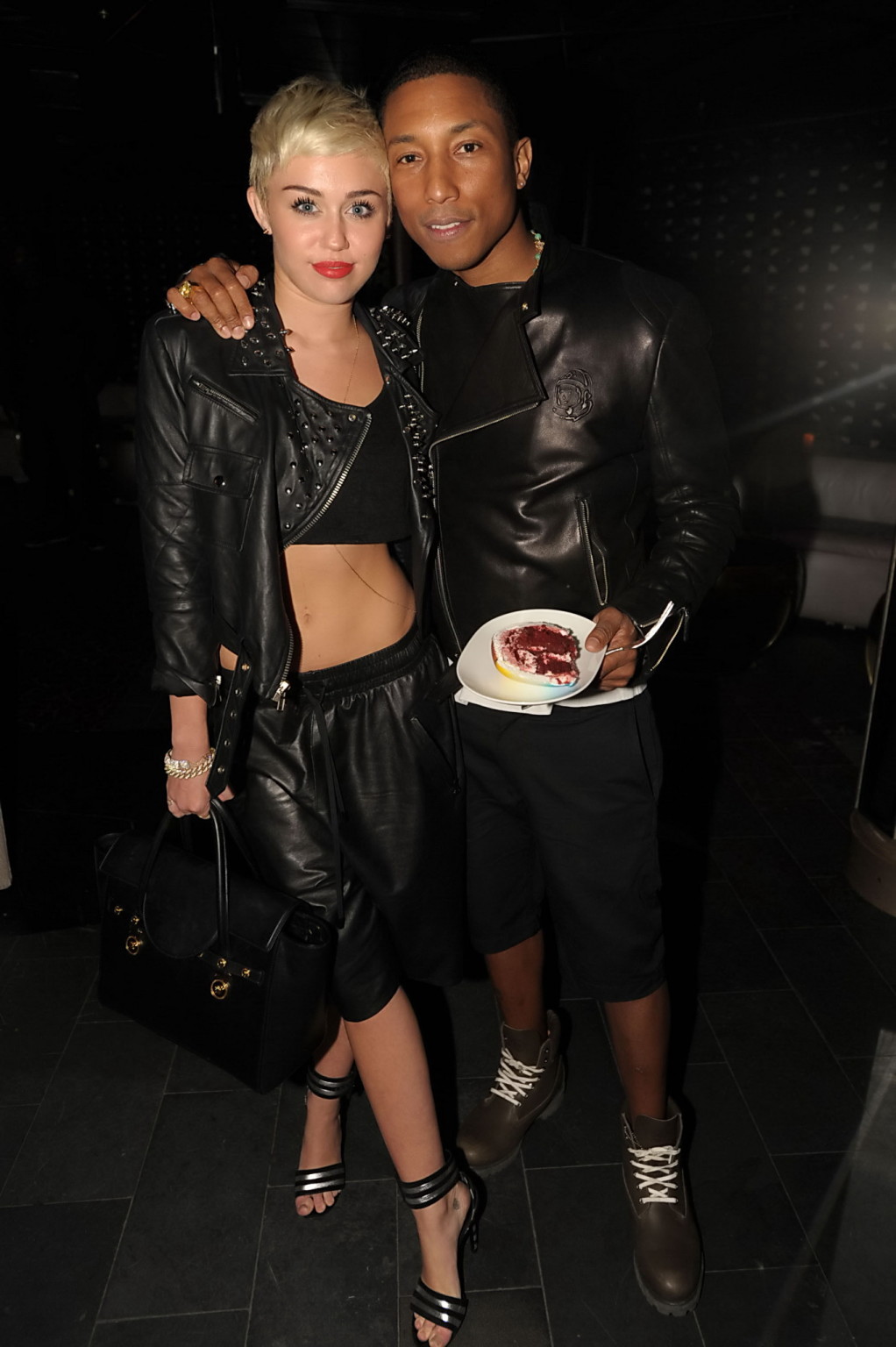 Miley Cyrus wears black belly top and leather shorts at Pharrell Williams's birt #75236163