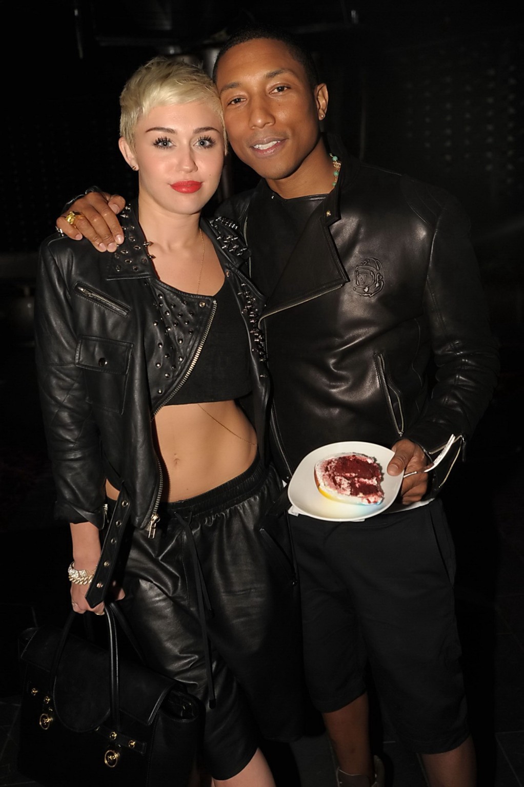 Miley Cyrus wears black belly top and leather shorts at Pharrell Williams's birt #75236173