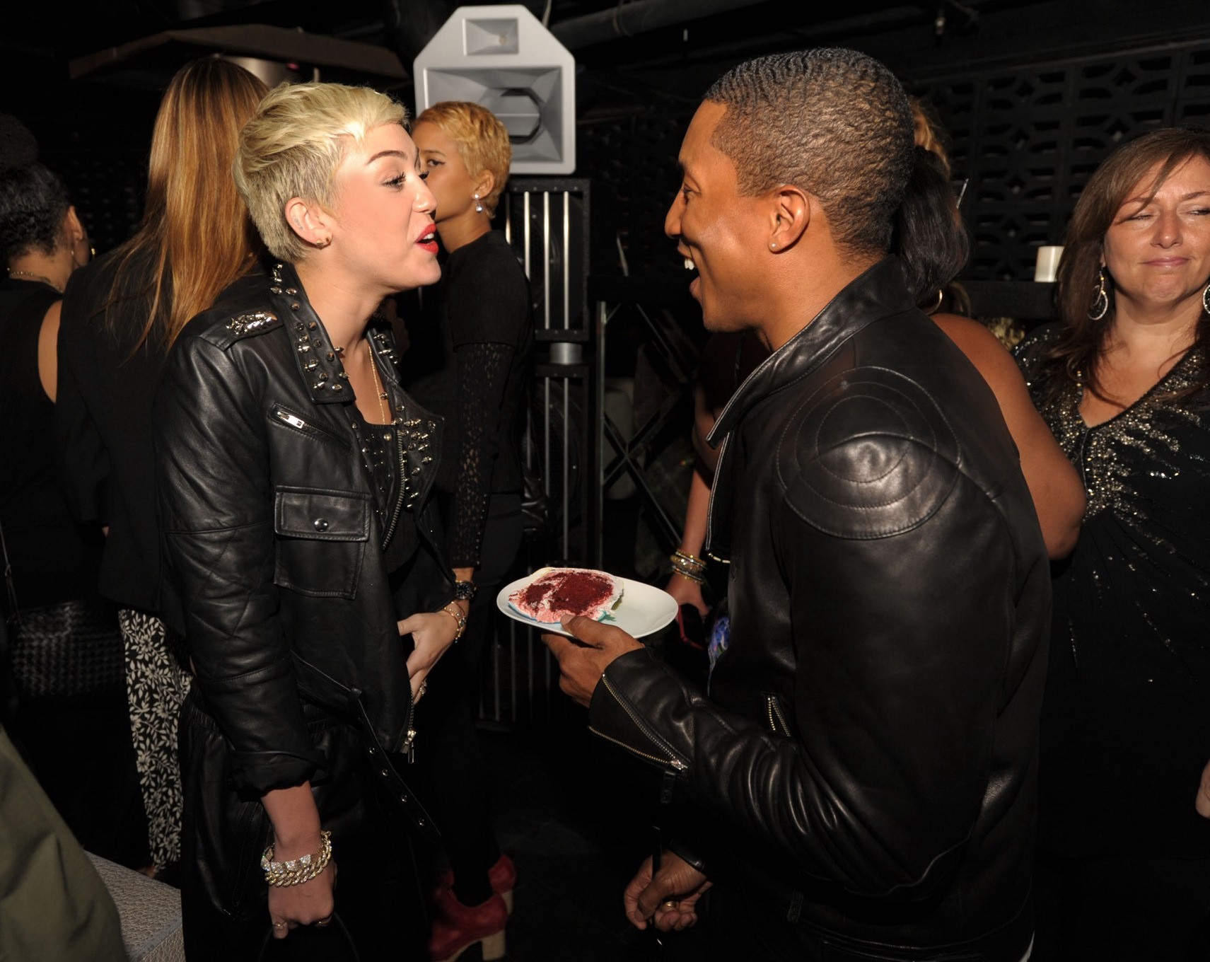 Miley Cyrus wears black belly top and leather shorts at Pharrell Williams's birt #75236196