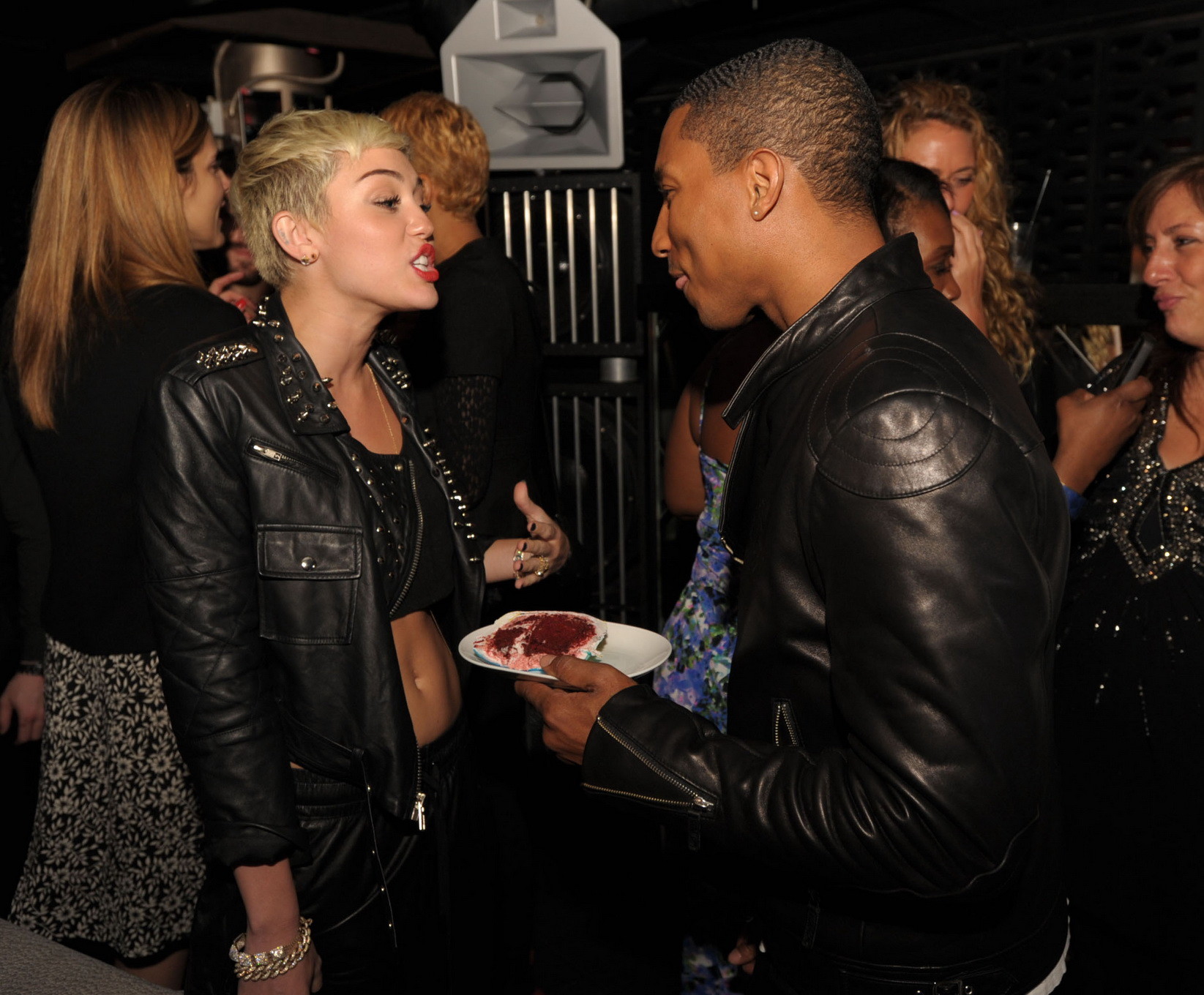 Miley Cyrus wears black belly top and leather shorts at Pharrell Williams's birt #75236200