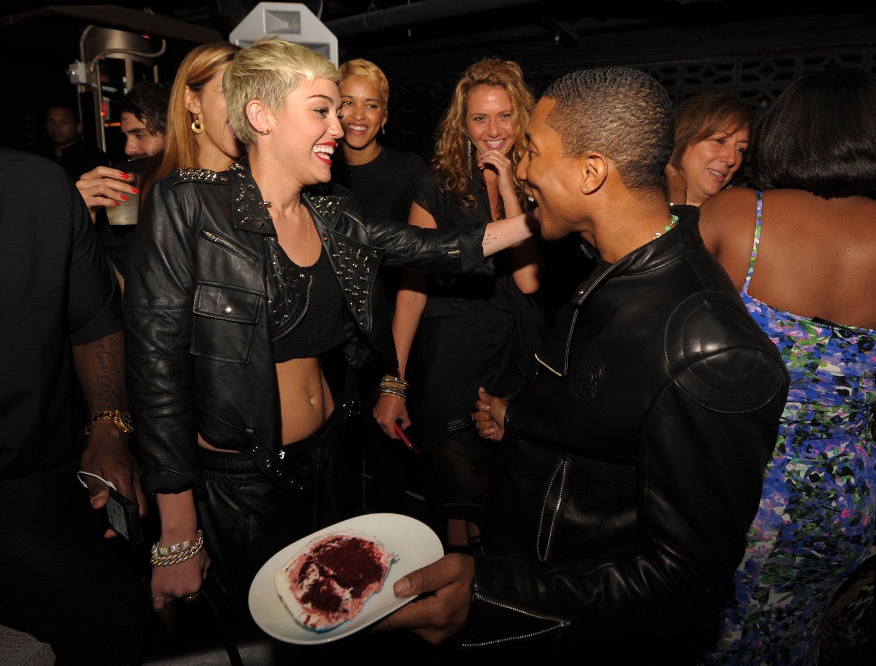 Miley Cyrus wears black belly top and leather shorts at Pharrell Williams's birt #75236209