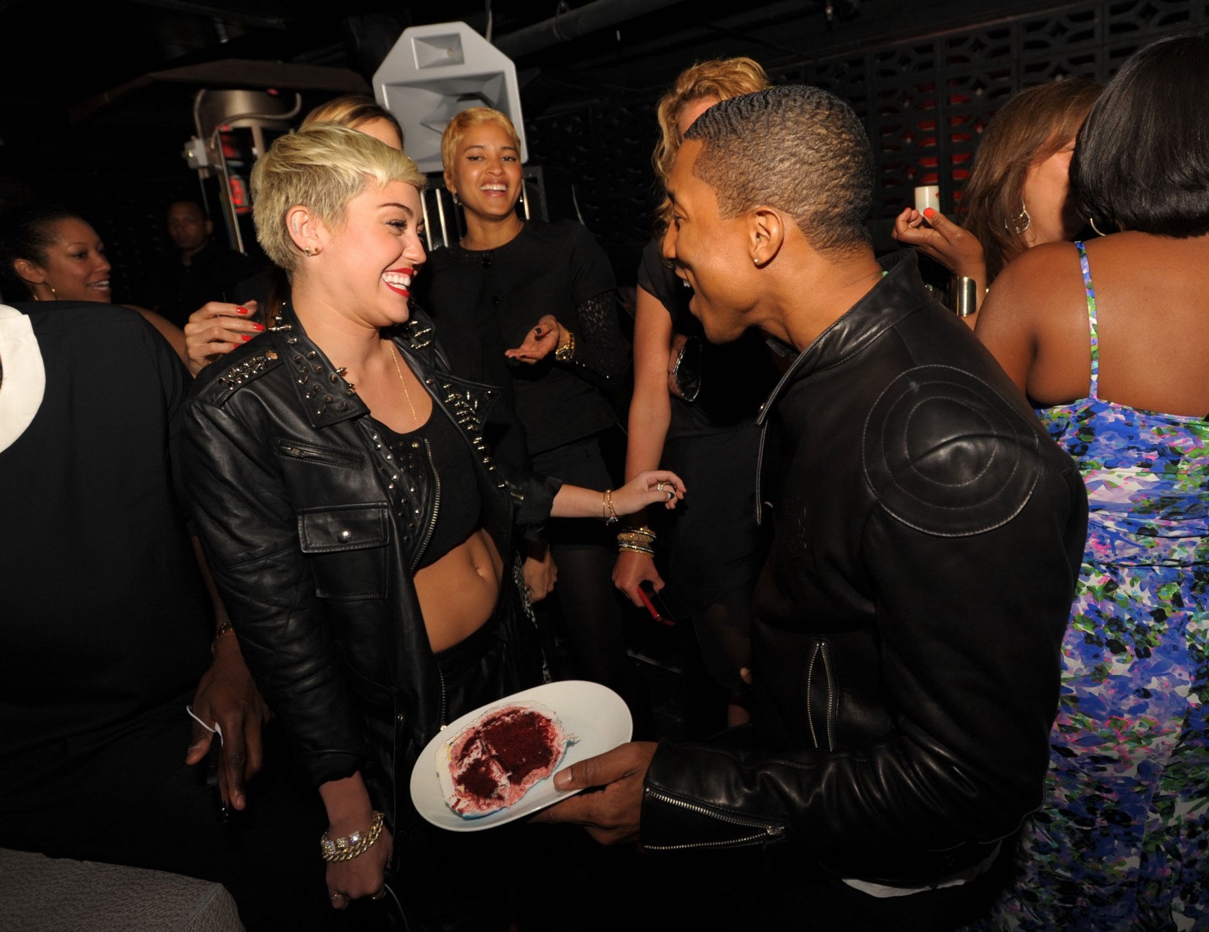 Miley Cyrus wears black belly top and leather shorts at Pharrell Williams's birt #75236220