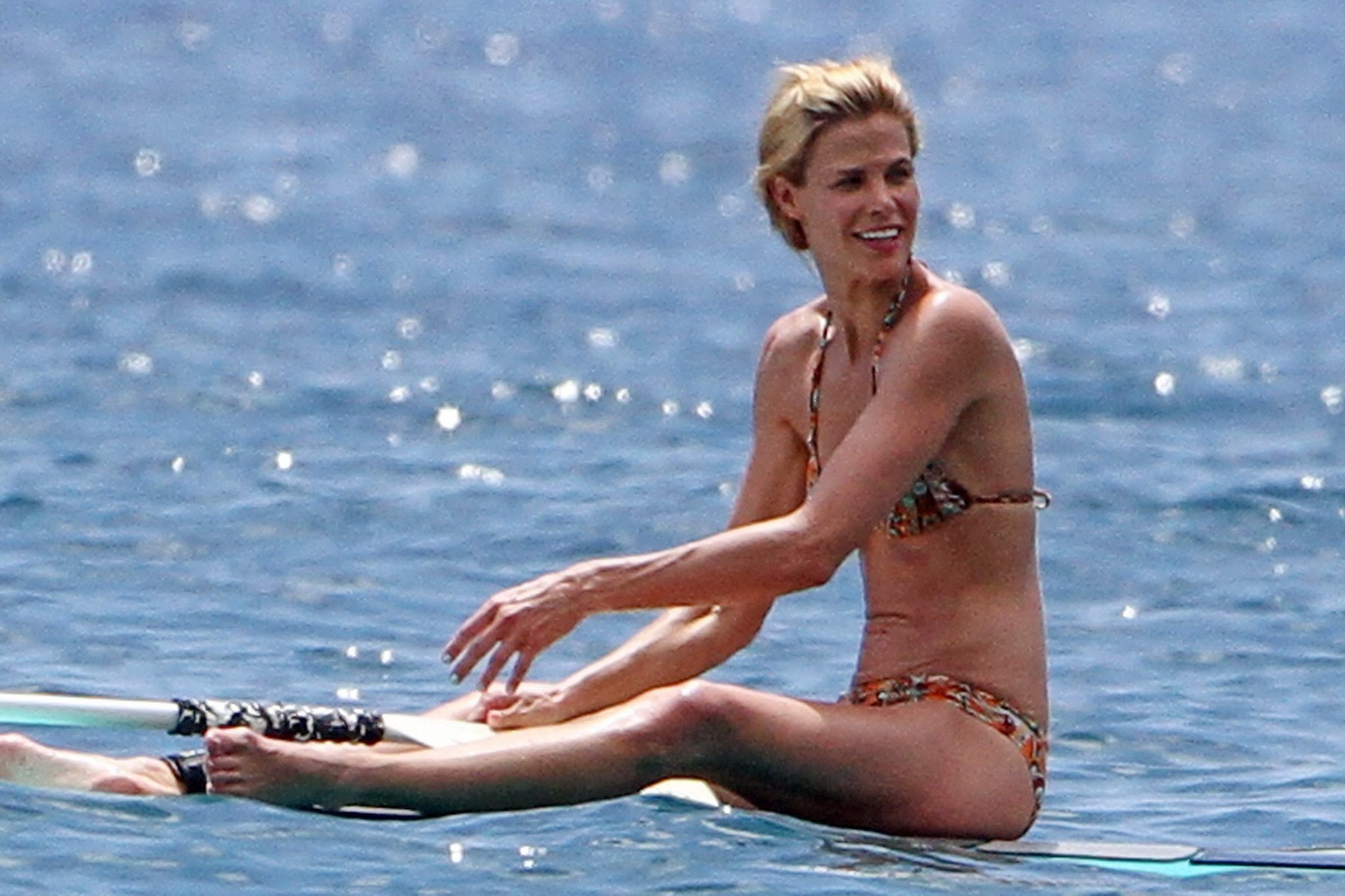 Brooke Burns in bikini paddle surfing on a Hawaiian beach #75304145
