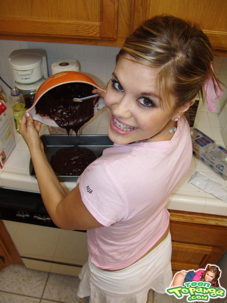 Eighteen year old bakes cake and strips in kitchen #78743233