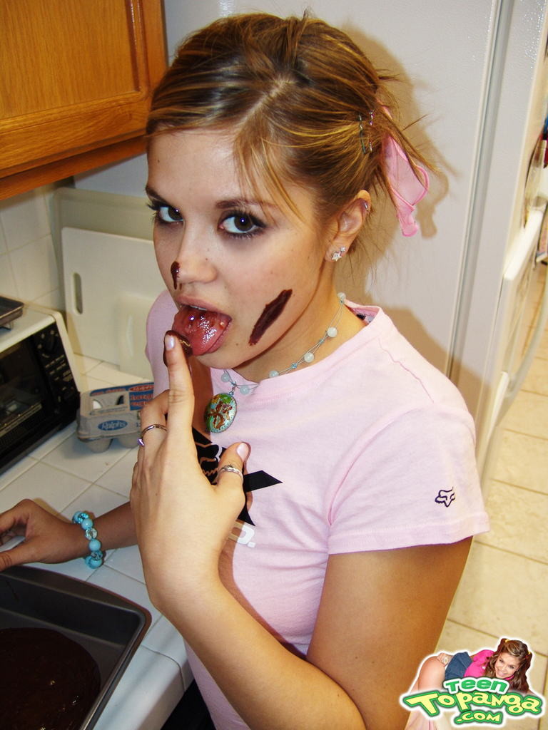 Eighteen year old bakes cake and strips in kitchen #78743254