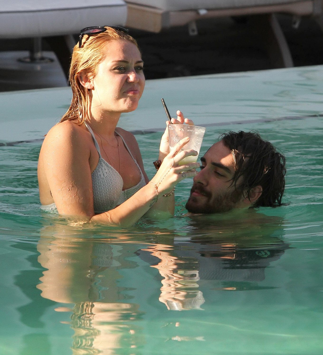 Miley Cyrus wearing white bikini at a hotel pool in Miami #75260222
