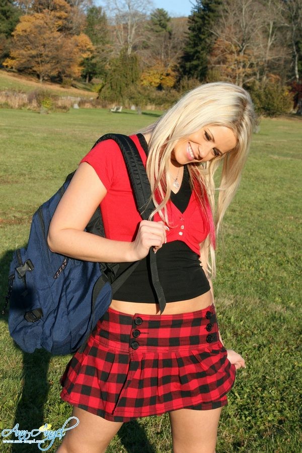 Busty Anna Angel in a tight red schoolgirl outfit outdoors #79036229