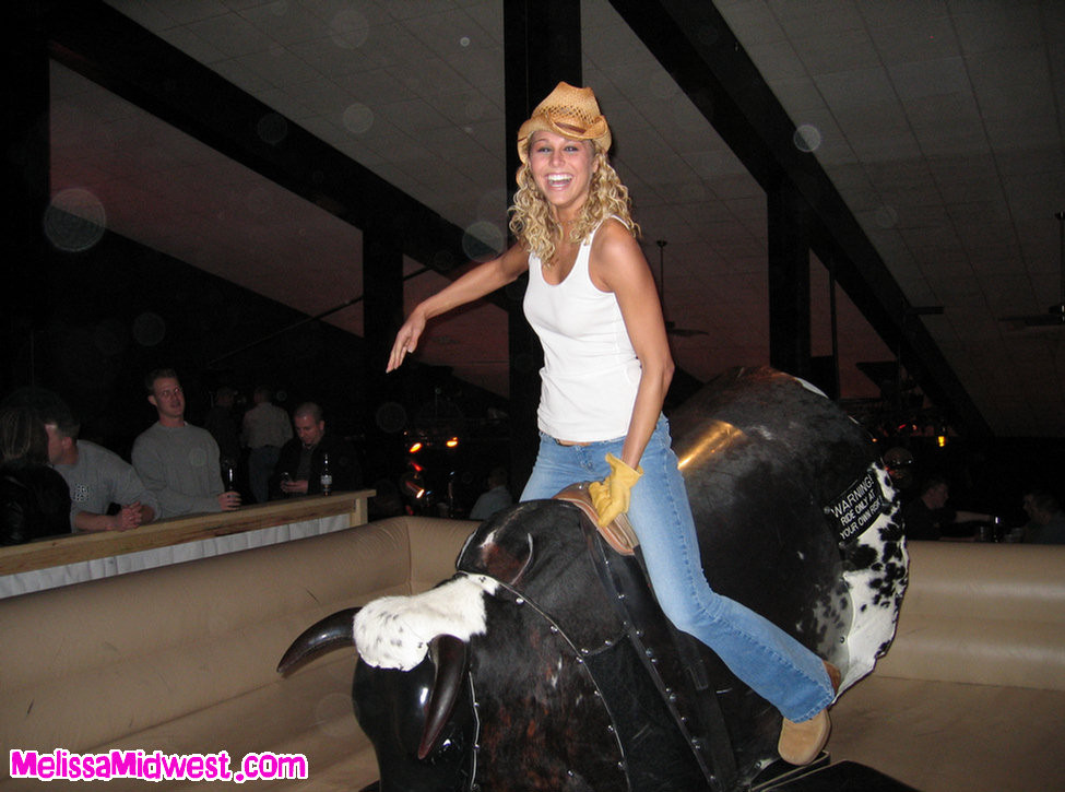 Melissa Midwest riding a mechanical bull #67275052