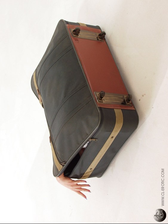 Contortionist in panties fits in a suitcase #73263290