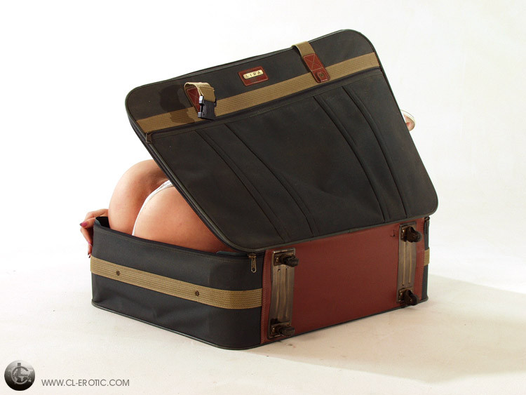Contortionist in panties fits in a suitcase #73263310