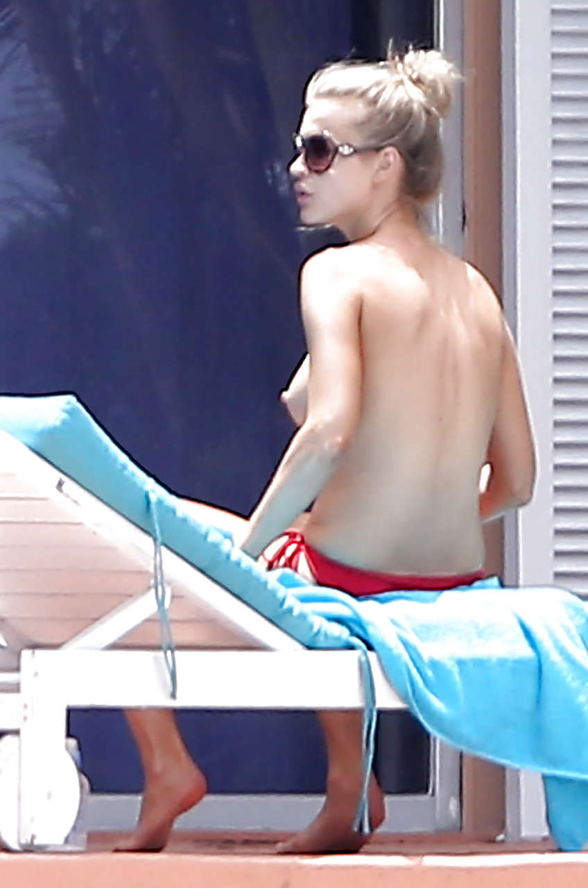 Joanna Krupa showing hot body in topless bikini out poolside  #75230177