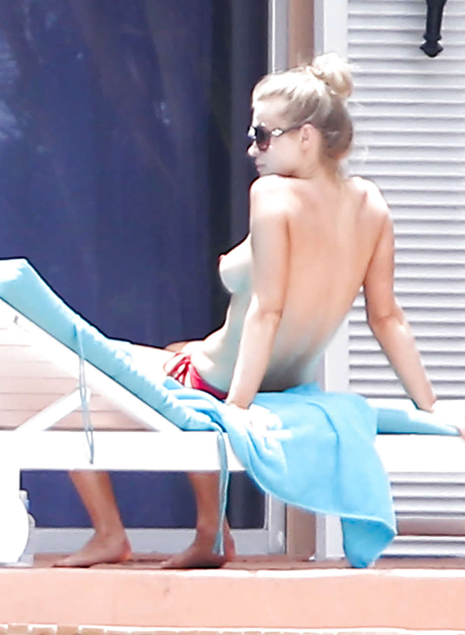 Joanna Krupa showing hot body in topless bikini out poolside  #75230184