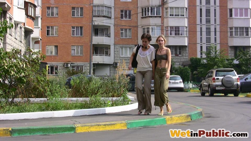 Two ladies wet their pants in another city and change on the street #73240659